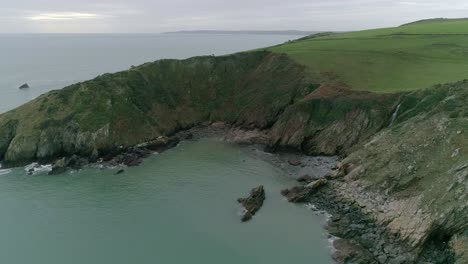 Aerial-tracking-over-an-open-cove-in-the-south-of-Devon