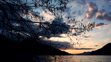 inspiration-sunset-on-lake-with-mountains-in-background