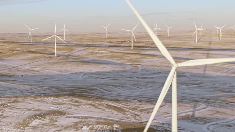 Aerial-shots-of-wind-turbines-on-a-cold-winter-afternoon-in-Calhan,-Colorado