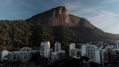 Slow-upwards-aerial-movement-showing-the-Corcovado-mountain-in-Rio-de-Janeiro-seen-from-the-city-lake-at-sunrise