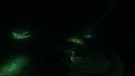Airplane-wreckage-underwater-at-night