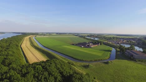 Aerial:-The-surroundings-and-the-historical-touristic-town-of-Veere,-the-Netherlands