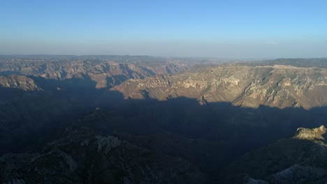 Aerial-wide-shot-of-the-epic-Urique-Canyon-at-sunset-in-Divisadero,-Copper-Canyon-Region,-Chihuahua