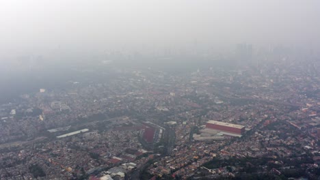 Aerial-wide-shot-of-Mexico-City-with-a-lot-of-pollution