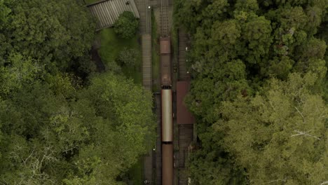 Zoom-out-the-old-train-on-the-railways-in-Alishan---Aerial-photography,-top-view