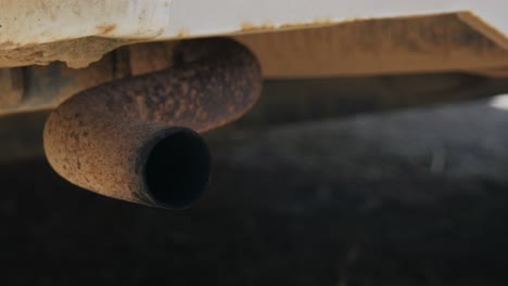 Close-up-of-an-old-vehicles-tailpipe-polluting-the-atmosphere-with-it's-emissions