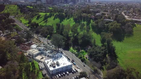 Tilt-up-from-urban-park-to-reveal-downtown-Los-Angeles-skyline