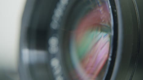 Macro-shot-of-a-lens-reflecting-a-display-with-movement