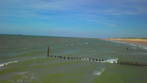 Wavebreakers-at-the-beach-of-Cadzand,-the-Netherlands