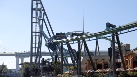 SLOW-MOTION-PANNING-LEFT-The-Flying-Dinosaur-rollercoaster-in-Universal-Studios-Japan