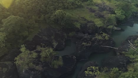 Drone-footage-following-a-river-during-a-sunrise