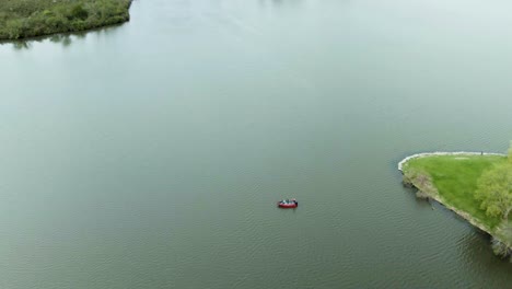 An-aerial-shot-of-a-couple-of-small-fishing-boats-on-Tampier-Slough-lake-in-Illinois