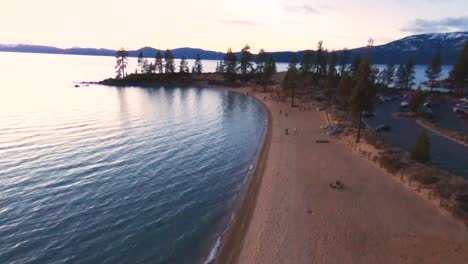 Aerial-view-of-beach-at-evening-in-Lake-Tahoe,-NV,-USA