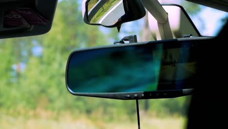 View-from-inside-the-car-to-the-rear-view-mirror-while-other-car-is-overtaking