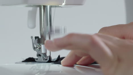 sewing-a-black-cloth-with-a-sewing-machine