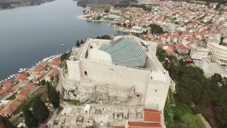 Point-of-drone-view-around-Saint-Michael-fortress-and-Sibenik-aquatorium-panoramic-view