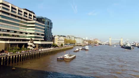 People-walking-beside-the-River-in-London