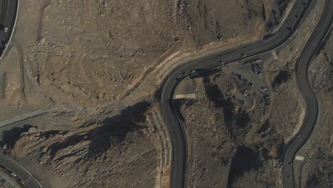 Drone-shot-of-a-Zig-Zag-Road-in-a-Rocky-Mountain