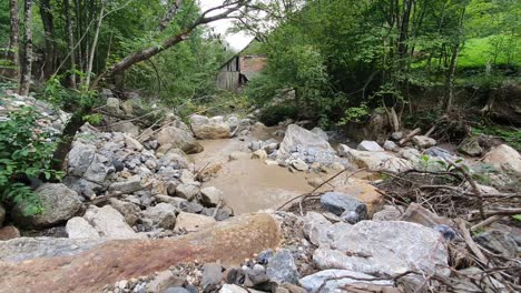 Brown-river-stream-with-big-rocks