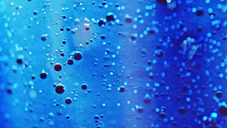 macro-shot-of-little-ink-bubbles-floating-in-sparkling-water