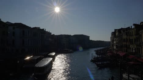 Iconic-view-at-Grand-Canal-from-Rialto-Bridge,-vaporetto-in-foreground