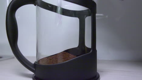 Prepare-instant-coffee-by-adding-granules-and-heated-water