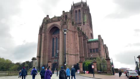 Tilt-up-shot-of-the-Liverpool-cathedral-with-people-going-to-the-church