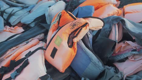 Childs-lifejacket-among-thousands-refugee-route-Lesvos,-Greece