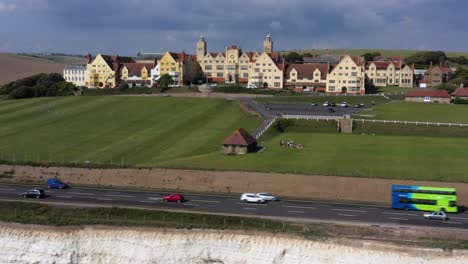 Wide-aerial-profile-view-of-Roedean-School,-situated-on-the-Chalk-cliffs-near-Brighton,-UK