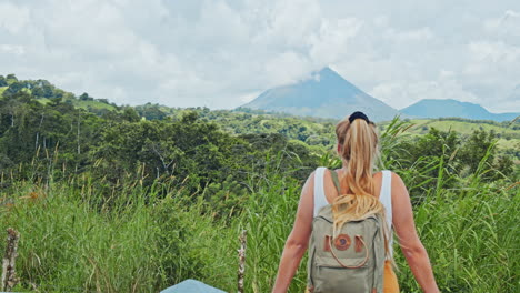Shot-of-blonde-girl-watching-at-the-Arenal-Volcano-in-Costa-Rica