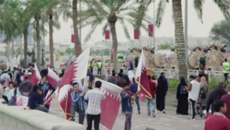 People-waiving-Flags-in-slow-motion-on-Qatar-National-day-in-corniche-Doha