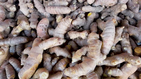Fresh-turmeric-root-on-the-table-of-open-market