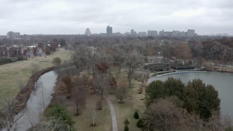 City-park-on-dreary-winter-day,-buildings-in-background