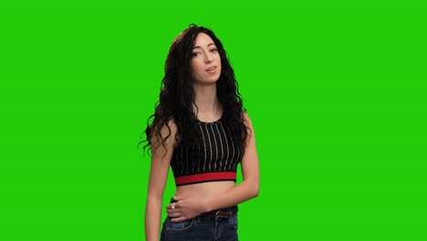 Portrait-of-cute-brunette-woman-with-long-curly-hair-shows-thumb-up-gesture-on-green-screen