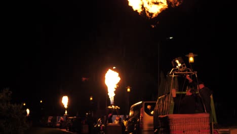 Balloon-fire-show-at-night-in-rainy-weather
