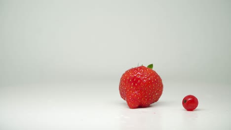 Red-Strawberry-And-Cherry-Fruits-On-Turntable-With-Pure-White-Background---Close-Up-Shot