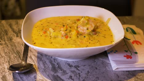 Spicy-savoury-pouring-fish-soup-homemade-atlantic-prawns-closeup