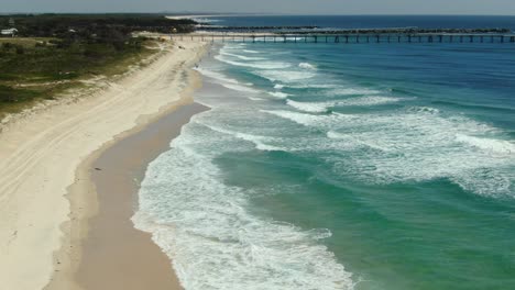 Flying-towards-the-Gold-Coast-seaway-,-Golden-beaches-and-waves-rolling-in