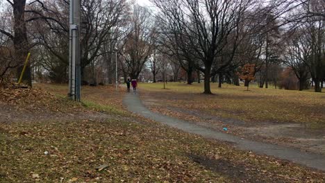 Two-women-leisurely-walking-Dufferin-Park-path