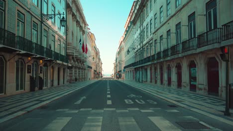 Lisbon-empty-downtown-streets-at-sunrise-during-covid-pandemic,-4K-Traveling-shot