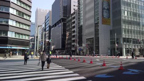 Tokyo-Marathon-day,-slow-motion-pan-over-closed-streets-in-urban-neighborhood