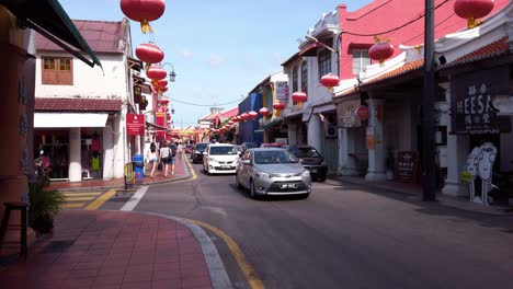 Dolly-in-wide-angle-shot-of-Malacca-old-town-during-rush-hour-in-summer