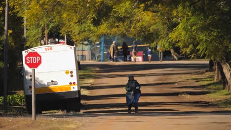 Domestic-workers-walking-to-work-down-empty-street-during-the-COVID-19-pandemic,-South-Africa