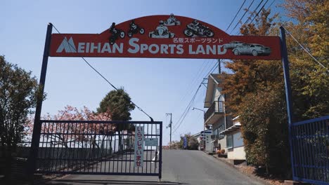 Tilting-Shot-Revealing-the-Front-Gate-and-Sign-of-Meihan-Sports-Land
