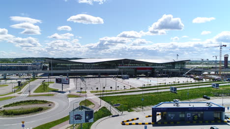 Drone-shot-of-empty-parking-spaces-and-terminal-at-Gdansk-airport-in-Poland
