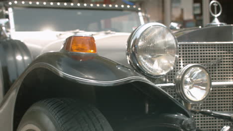 Headlight-and-fender-on-classic-Excalibur-automobile,-Slide-Right