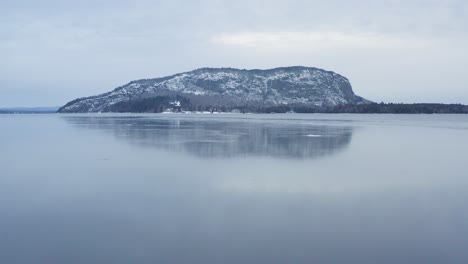 Ice-formed-on-surface-of-Moosehead-Lake-with-Mount-Kineo-Aerial