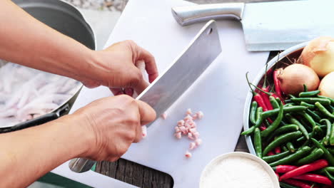 Top-down-shot-Chef´s-hands-Cut-off-Finger-nails-from-chicken-feet---Kitchen-Environment