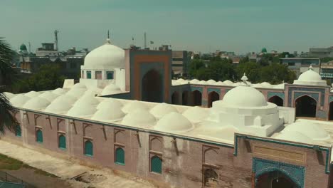 Aerial-View-From-Outside-Shah-Jahan-Mosque-In-Thatta-Over-Roof-Domes-In-Pakistan