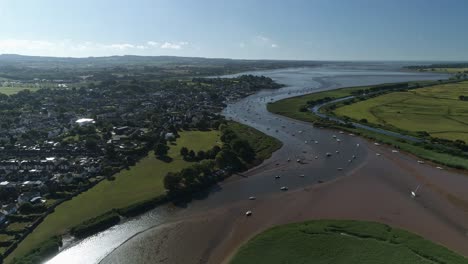 Aerial-of-the-village-of-Topsham-in-the-shade-on-a-sunny-morning